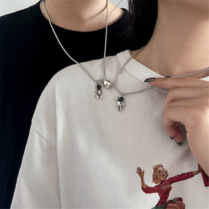 COLLARES ASTRONAUTAS CORAZON MAGNETICO EN ACERO INOXIDABLE